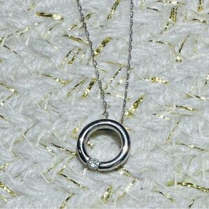 Platinum pendant with tension set Diamond